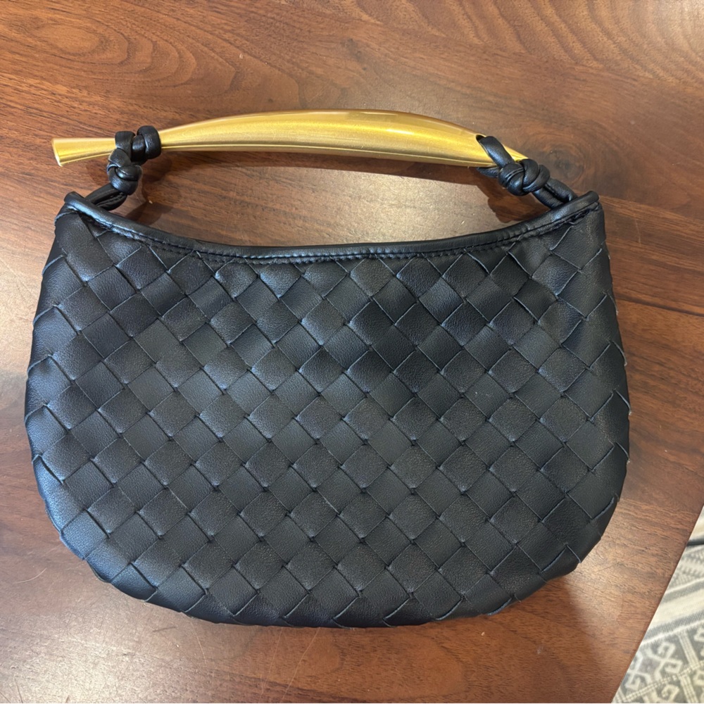 Black clutch with gold handle
